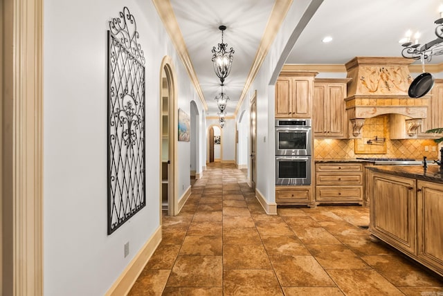 31 Cravache Ct, Little Rock, AR 72223 - kitchen featuring stainless steel appliances, arched walkways, a chandelier, baseboards, and ornamental molding