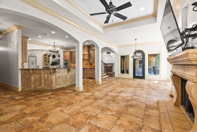 31 Cravache Ct, Little Rock, AR 72223 - living area with a chandelier, baseboards, a ceiling fan, a fireplace with raised hearth, and arched walkways