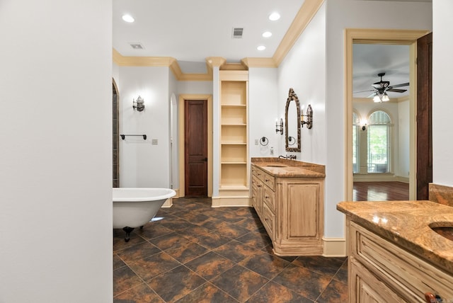 31 Cravache Ct, Little Rock, AR 72223 - bathroom with two vanities, crown molding, a freestanding tub, ceiling fan, and recessed lighting
