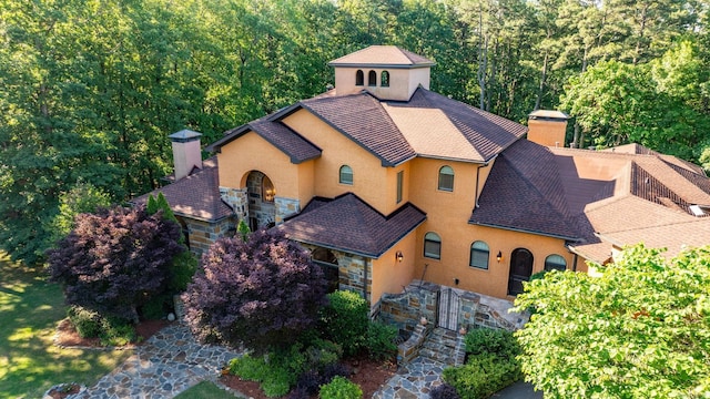31 Cravache Ct, Little Rock, AR 72223 - view of front facade featuring a chimney, stone siding, and a shingled roof