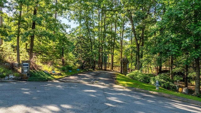 31 Cravache Ct, Little Rock, AR 72223 - view of asphalt road with a view of trees