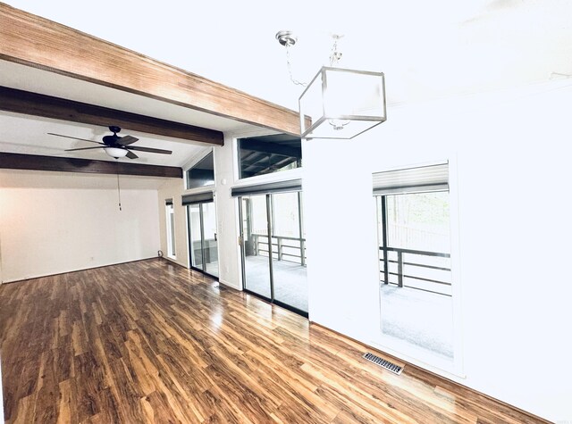 spare room featuring wood finished floors and ceiling fan