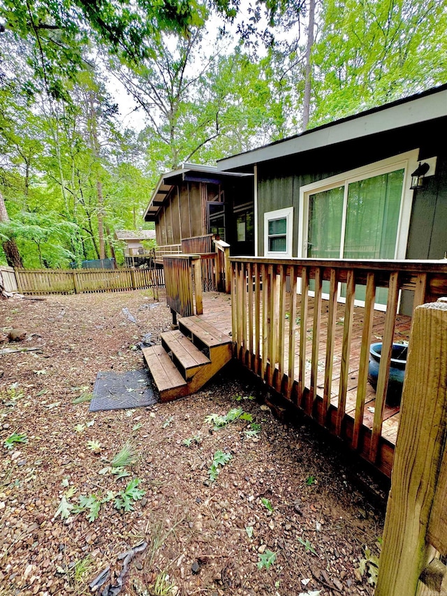 wooden deck with a sunroom