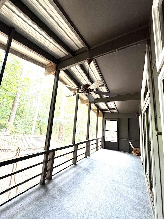 unfurnished sunroom with lofted ceiling