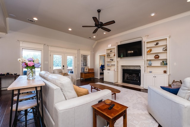 6 W Lake Ln, Little Rock, AR 72210 - living area featuring ceiling fan, french doors, dark wood-type flooring, a fireplace with flush hearth, and recessed lighting