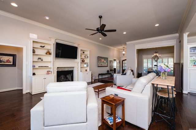 6 W Lake Ln, Little Rock, AR 72210 - living room featuring ornamental molding, ceiling fan, dark wood-style flooring, a chandelier, and a fireplace