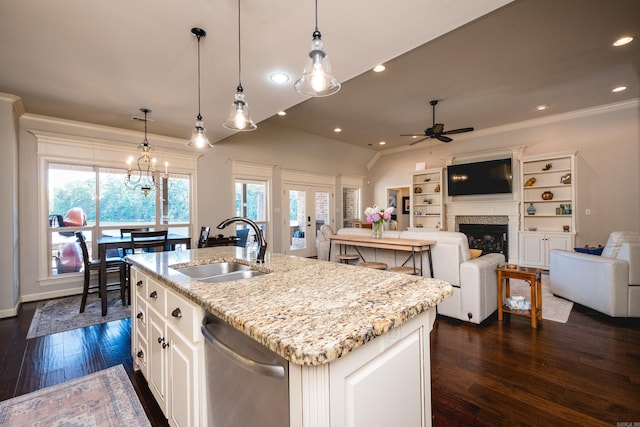 6 W Lake Ln, Little Rock, AR 72210 - kitchen with a sink, stainless steel dishwasher, a ceiling fan, light stone counters, and a fireplace