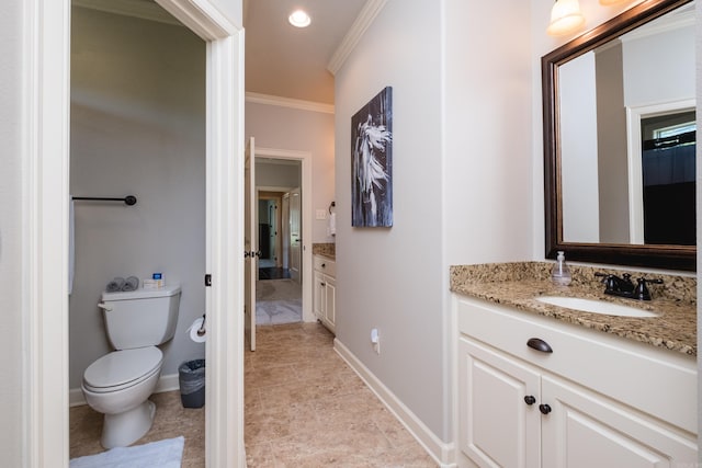 6 W Lake Ln, Little Rock, AR 72210 - bathroom with vanity, ornamental molding, baseboards, toilet, and recessed lighting