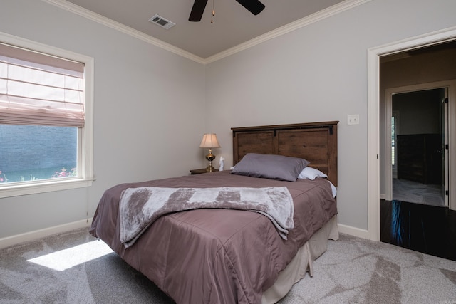 6 W Lake Ln, Little Rock, AR 72210 - carpeted bedroom with ornamental molding, baseboards, and a ceiling fan