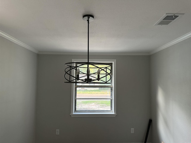 detailed view of a chandelier and crown molding