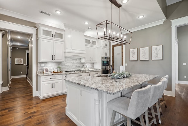 2059 Sloan Lake Dr, Jonesboro, AR 72404 - kitchen featuring appliances with stainless steel finishes, backsplash, baseboards, a sink, and recessed lighting