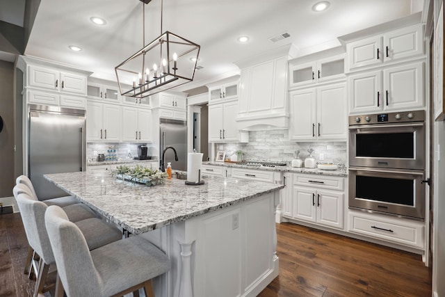 2059 Sloan Lake Dr, Jonesboro, AR 72404 - kitchen with appliances with stainless steel finishes, a sink, white cabinetry, recessed lighting, and dark wood-style flooring