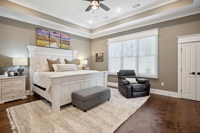 2059 Sloan Lake Dr, Jonesboro, AR 72404 - bedroom featuring ornamental molding, dark wood finished floors, baseboards, a raised ceiling, and ceiling fan