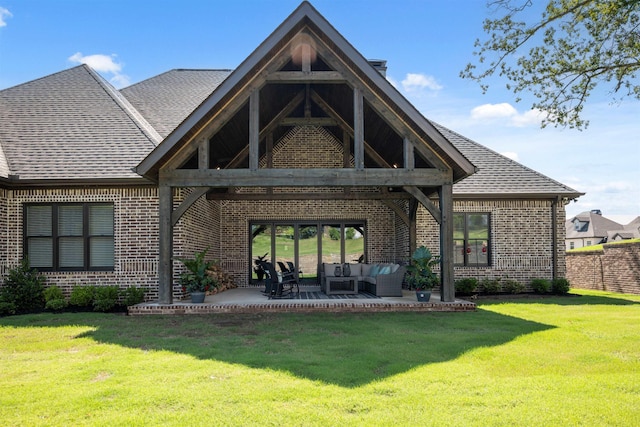 2059 Sloan Lake Dr, Jonesboro, AR 72404 - back of property featuring brick siding, outdoor lounge area, a patio, and roof with shingles