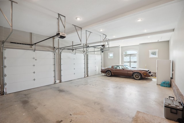 2059 Sloan Lake Dr, Jonesboro, AR 72404 - garage featuring a garage door opener and recessed lighting