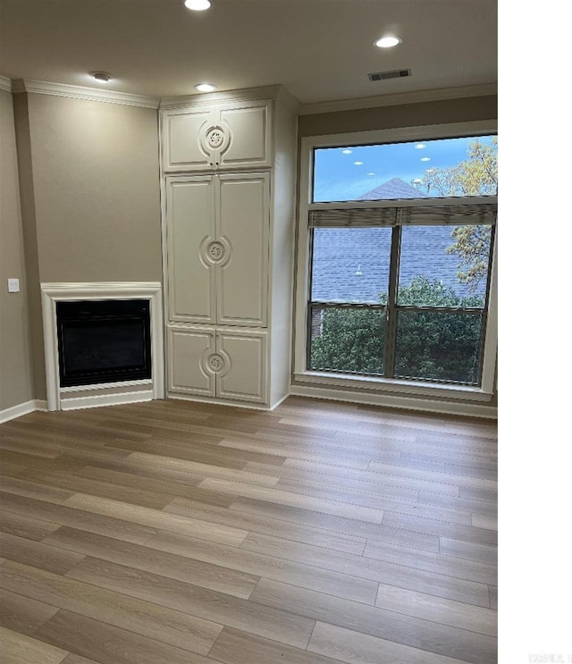 10 Calumet Rd, Little Rock, AR 72223 - unfurnished living room with crown molding, plenty of natural light, a fireplace, recessed lighting, and light wood finished floors