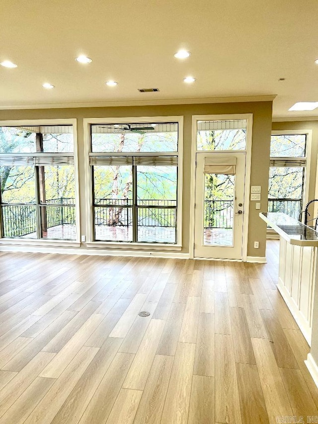 10 Calumet Rd, Little Rock, AR 72223 - doorway to outside featuring healthy amount of natural light, ornamental molding, light wood-style flooring, recessed lighting, and baseboards