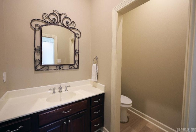 10 Calumet Rd, Little Rock, AR 72223 - bathroom featuring vanity, toilet, wood finished floors, and baseboards