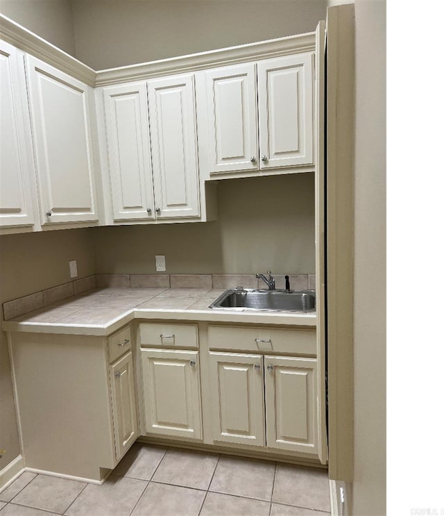 10 Calumet Rd, Little Rock, AR 72223 - kitchen featuring a sink, light tile patterned flooring, and light countertops