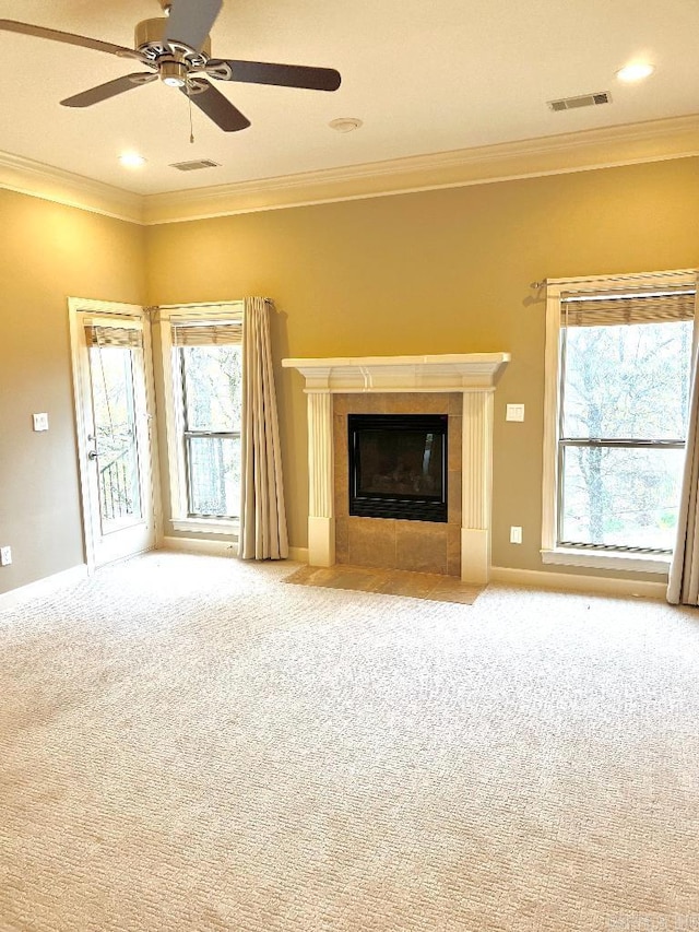 10 Calumet Rd, Little Rock, AR 72223 - unfurnished living room with plenty of natural light, carpet flooring, ceiling fan, crown molding, and a tiled fireplace