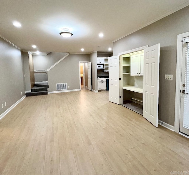 10 Calumet Rd, Little Rock, AR 72223 - unfurnished living room with crown molding, light wood-style floors, recessed lighting, stairway, and baseboards