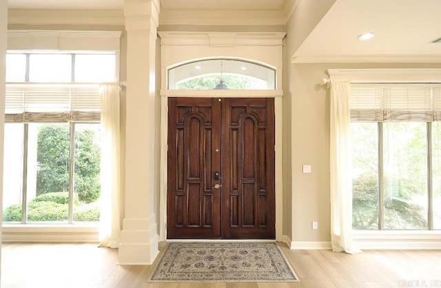 10 Calumet Rd, Little Rock, AR 72223 - foyer entrance with ornamental molding, plenty of natural light, baseboards, and wood finished floors