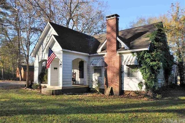 605 School St, Sheridan, AR 72150 - view of front of house with a front lawn and a chimney