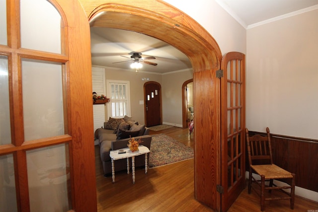 605 School St, Sheridan, AR 72150 - entryway with arched walkways, wood finished floors, a ceiling fan, and ornamental molding