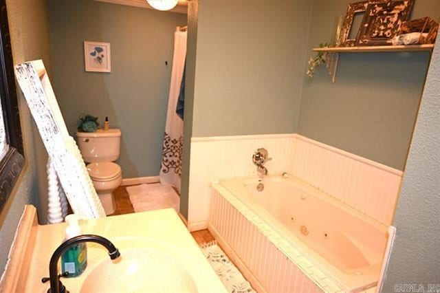 605 School St, Sheridan, AR 72150 - full bathroom with toilet, a jetted tub, a wainscoted wall, and vanity