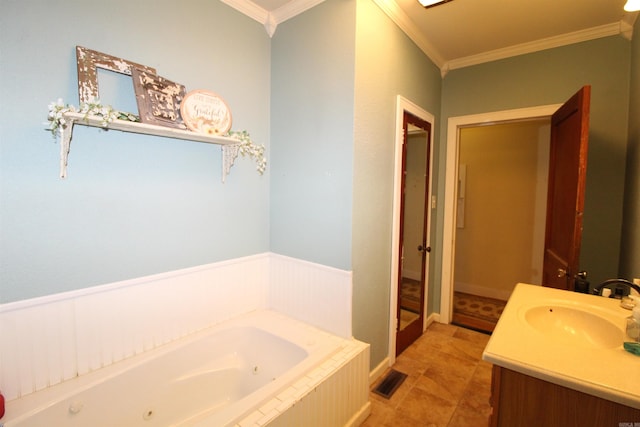 605 School St, Sheridan, AR 72150 - bathroom with ornamental molding, a jetted tub, vanity, a wainscoted wall, and tile patterned floors