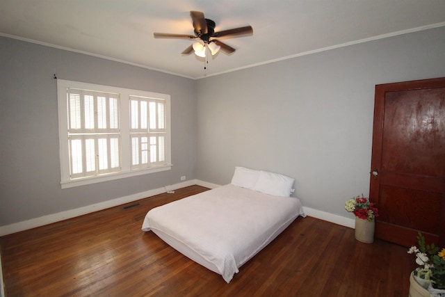 605 School St, Sheridan, AR 72150 - bedroom featuring baseboards, wood finished floors, ornamental molding, and a ceiling fan