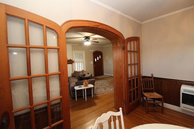 605 School St, Sheridan, AR 72150 - sitting room with arched walkways, heating unit, wood finished floors, ornamental molding, and ceiling fan