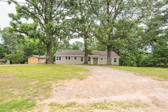 919 River Rdg, Benton, AR 72019 - single story home with dirt driveway, a front yard, and view of scattered trees