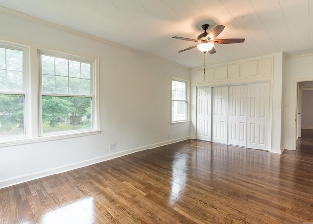 919 River Rdg, Benton, AR 72019 - unfurnished bedroom featuring crown molding, wood finished floors, a closet, baseboards, and a ceiling fan