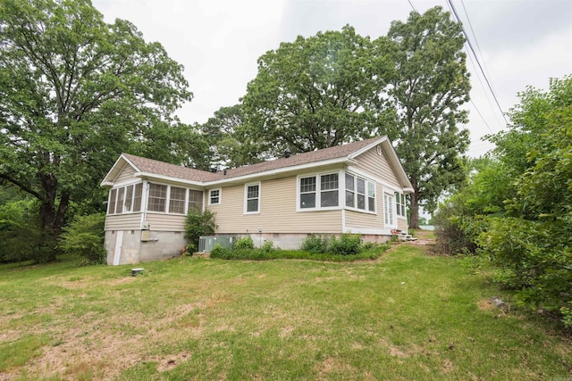919 River Rdg, Benton, AR 72019 - rear view of house with crawl space, a sunroom, a lawn, and central AC unit