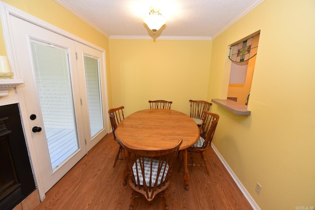 135 Hillview Dr Unit 82, Fairfield Bay, AR 72088 - dining space with light wood-type flooring, ornamental molding, and baseboards
