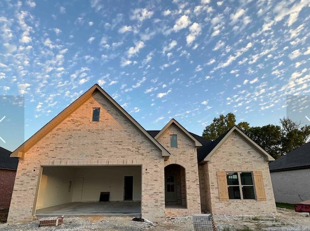 18 Dandelion Dr, Greenbrier, AR 72058 - view of front of house with brick siding and a garage