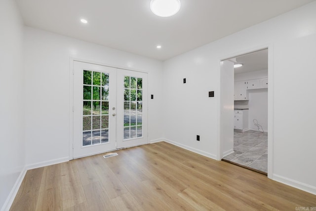 41 Brookridge Dr, Little Rock, AR 72205 - empty room featuring french doors, light wood-style floors, baseboards, and recessed lighting