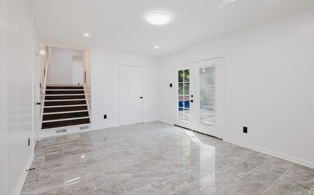 41 Brookridge Dr, Little Rock, AR 72205 - unfurnished room featuring stairway, french doors, marble finish flooring, baseboards, and recessed lighting