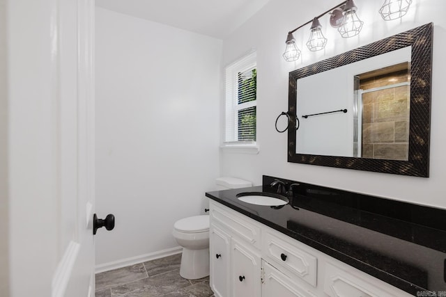 41 Brookridge Dr, Little Rock, AR 72205 - full bathroom with vanity, toilet, baseboards, and tiled shower