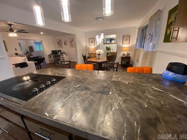 8 Westbrook Cv, Little Rock, AR 72205 - kitchen with black electric cooktop, open floor plan, and a ceiling fan