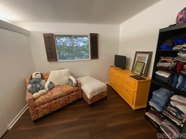 8 Westbrook Cv, Little Rock, AR 72205 - sitting room featuring dark wood-style flooring and baseboards