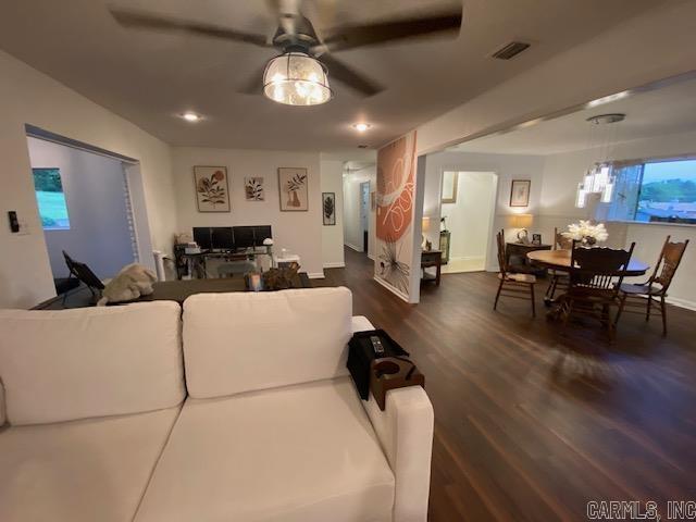8 Westbrook Cv, Little Rock, AR 72205 - living room with dark wood-type flooring, a ceiling fan, baseboards, and plenty of natural light