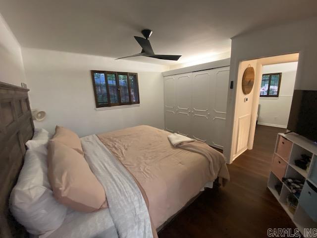 8 Westbrook Cv, Little Rock, AR 72205 - bedroom featuring dark wood finished floors and a ceiling fan