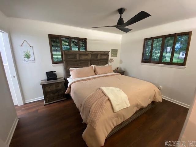 8 Westbrook Cv, Little Rock, AR 72205 - bedroom featuring wood finished floors, baseboards, and ceiling fan