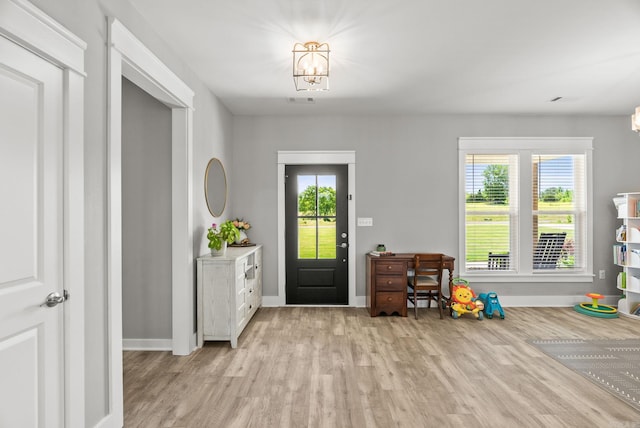 170 Irene Cir, Greenbrier, AR 72058 - foyer entrance featuring light wood-style flooring, baseboards, and a chandelier