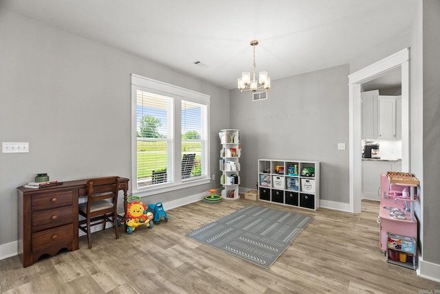 170 Irene Cir, Greenbrier, AR 72058 - playroom featuring wood finished floors, a chandelier, and baseboards