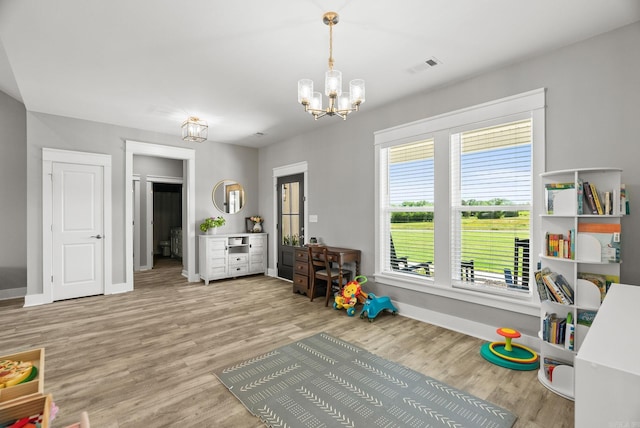 170 Irene Cir, Greenbrier, AR 72058 - recreation room featuring a chandelier, wood finished floors, and baseboards