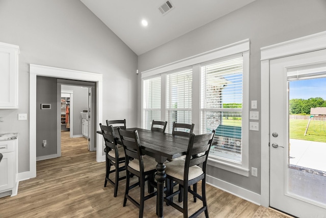 170 Irene Cir, Greenbrier, AR 72058 - dining area featuring baseboards, light wood-style flooring, and high vaulted ceiling
