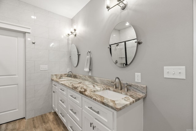 170 Irene Cir, Greenbrier, AR 72058 - full bath with double vanity, wood finished floors, tile walls, and tiled shower